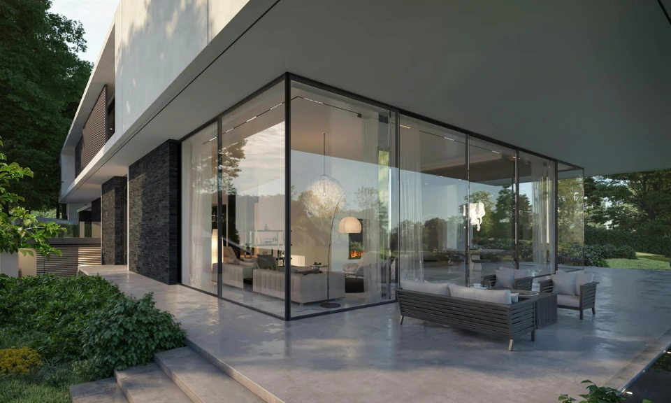 Maison moderne : façade vitrée, intérieur lumineux, mobilier design et terrasse en béton lisse.